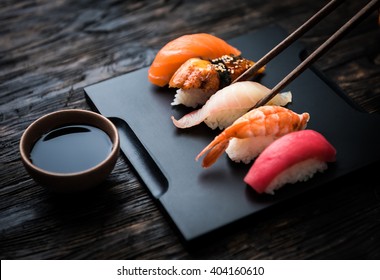 close up of sashimi sushi set with chopsticks and soy - Powered by Shutterstock