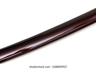 Close up 'Saya' : shining crimson red scabbard  of a 'katana' : Japanese long Sword isolated in white background. selective focus.