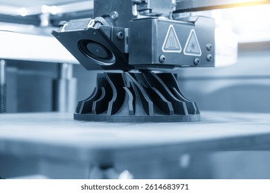 Close up scene the additive manufacturing by 3D printer machine in the light blue scene. The high technology manufacturing process by rapid prototype method. 
