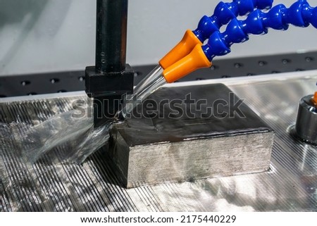 Close up scene of EDM processing by graphite electrode. The high technology mold and die manufacturing process by electrode discharge machine.