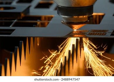 Close up scene the fiber laser cutting machine cut the metal plate with the sparkling light. The hi-technology sheet metal manufacturing process by laser cutting machine.  - Powered by Shutterstock