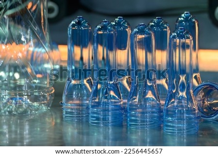 Close up scene of group of preform shape of PET bottle products. The raw material for plastic bottle manufacturing process.
