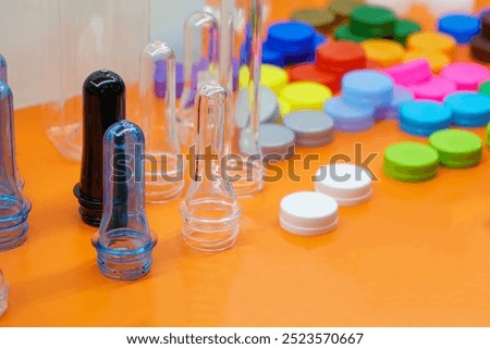 Close up scene of group of preform shape of PET bottle products. The raw material for plastic bottle manufacturing process.
