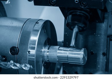 Close up scene the multi-tasking CNC lathe machine milling cut the metal shaft parts by milling turret. The high technology metal working with CNC turning machine. - Powered by Shutterstock