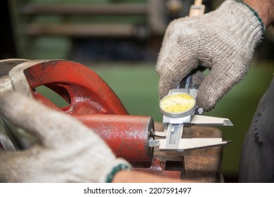 Close Up Scene The Operator Measuring Inside Diameter Casting Parts By Dial Vernier Caliper. The Quality Control On Turning Machine. 