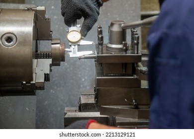 Close Up Scene The Operator Measuring Inside Diameter Casting Parts By Dial Vernier Caliper. The Quality Control On Turning Machine. 