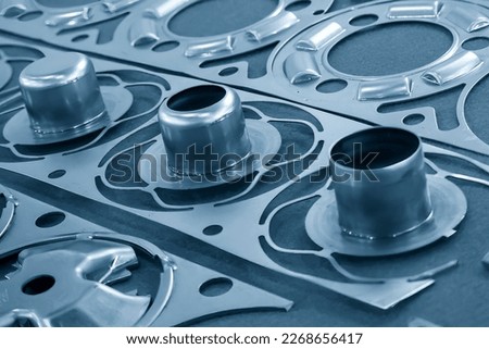 The close up scene of product parts from progressive die. The sample of metal forming by progressive die.
