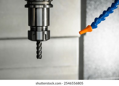Close up scene the solid flat nose end mill tool attached the spindle. The mold parts cutting process by machining center with solid flat nose  end mill. - Powered by Shutterstock - Get 15% off with code: PIKWIZARD15