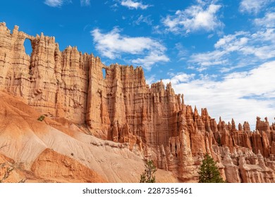 Close up scenic view of the wall of windows on Peekaboo hiking trail in Bryce Canyon National Park, Utah, USA. Massive steep hoodoo sandstone rock formations in natural amphitheatre in sunny summer - Powered by Shutterstock