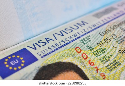Close up of a Schengen visa  Switzerland ,Schengen is a permit to enter the country. for a short visit to the area comprising the 27 European states - Shutterstock ID 2258382935