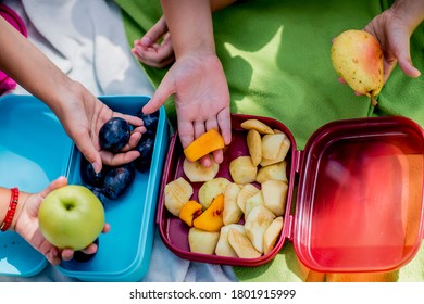 Close Up Of School Children Holding Healthy Snack