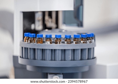 Close up of science experiment Vials filled inside an autosampler of an HPLC machine in a Science experiment laboratory for research analysis and clinical trial study 