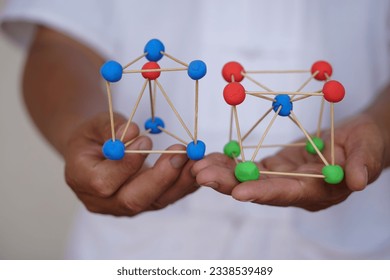 Close up scientific model teaching aid to teach about molecular structures, made from plasticine balls with tooth picks sticks. Concept, science education activity, creative DIY craft that kids can do - Powered by Shutterstock