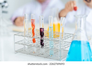 close up scientific test tube placed on the table in the science room. The colors are mixed in the test tube. doing chemistry experiments in elementary school - Shutterstock ID 2262769693