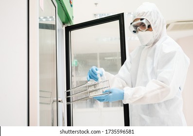 Close up scientist hand opening storage reagent container for laboratory analysis.Scientist hand holding reagent tube during prepare specimen for auto machine analysis.Laboratory medical analysis. - Shutterstock ID 1735596581