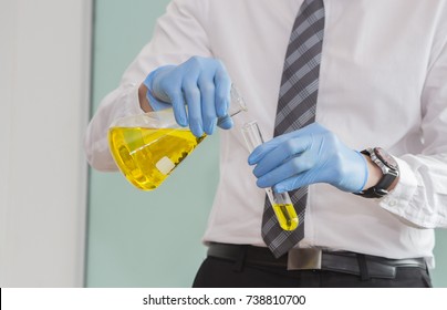 Close Up of Scientist Studying oil Solution in Test Tube