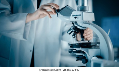Close Up of a Scientist Using Microscope to Analyze Biological Specimens. Anonymous Person Adding Liquid Solution to Multiple Petri Dishes. Laboratory Work for Advancing Medical Knowledge