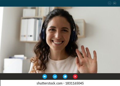 Close Up Screen View Portrait Of Smiling Caucasian Woman In Headphones Talk On Video Call Wave Greet. Happy Female Teacher Or Trainer Have Webcam Virtual Lesson Or Online Digital Training Conference.