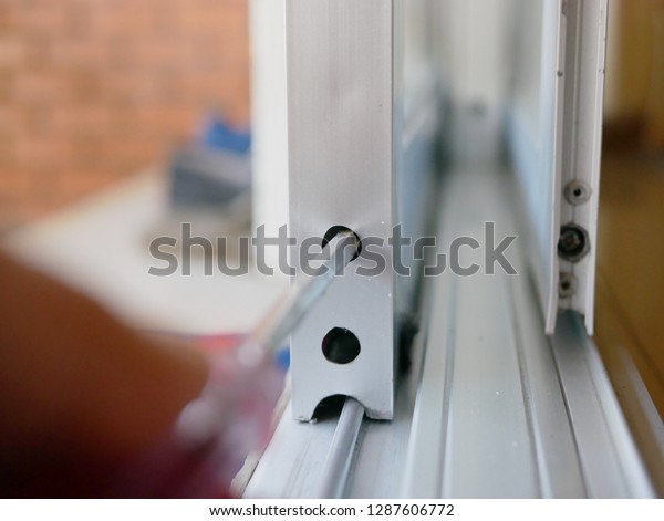 Close Screwdriver Mans Hand Adjusting Sliding Stock Photo Edit