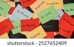 Close up seamless photo of colorful flash cards with handwriting german words as a concept of new language learning. Education and tutorial of foreign language speaking. efect of colors on memorizing.