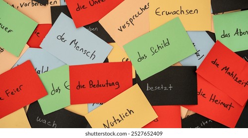 Close up seamless photo of colorful flash cards with handwriting german words as a concept of new language learning. Education and tutorial of foreign language speaking. efect of colors on memorizing. - Powered by Shutterstock