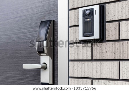 Close - up at Security intercom button in the apartment door