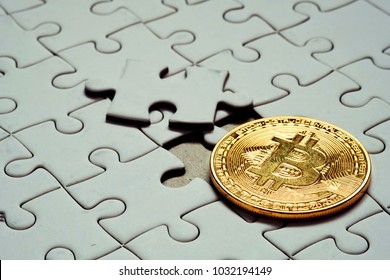 Close up a select focus gold bitcoin and Final piece of jigsaw puzzle