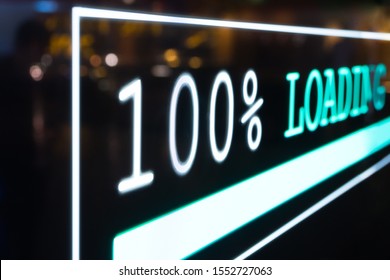 Close up and Selective focus. Futuristic transparent OLED screen dashboard illuminate blue pixel light and real-time display 100% loading status bar of computer network system information. - Powered by Shutterstock