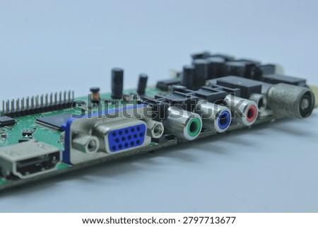 Close up selective focus of green printed circuit board PCB with VGA, HDMI and RCA audio video connectors on white background

Macro shot of an electronic circuit board featuring a blue VGA port, HDMI connector, and red, green, blue RCA jacks. Isolated on white background.