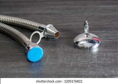 Close Up With Selective Focus Of A Metal Bidet / Hose