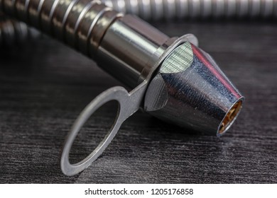 Close Up With Selective Focus Of A Metal Bidet / Hose