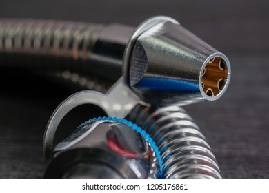 Close Up With Selective Focus Of A Metal Bidet / Hose