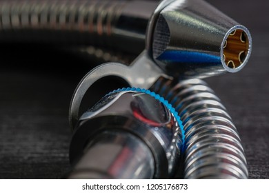 Close Up With Selective Focus Of A Metal Bidet / Hose