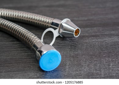 Close Up With Selective Focus Of A Metal Bidet / Hose