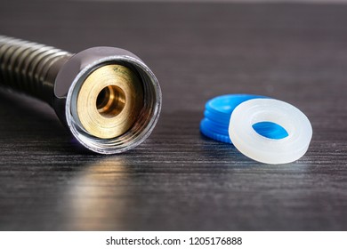 Close Up With Selective Focus Of A Metal Bidet / Hose