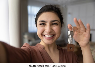 Close Up Self-portrait Picture Of Happy Indian Woman Feel Excited Show Keys To New Home. Selfie Of Smiling Mixed Race Ethnicity Female Renter Or Tenant Celebrate Moving Or Relocation To Own House.