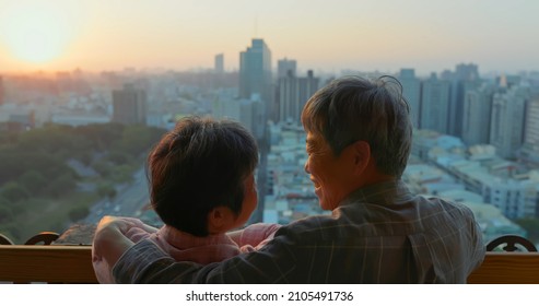 Close Up Of Senior Asian Couple Looking Each Other Outside