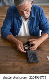 Close Up Of Senior Man Holding Wallet And Counting Money 