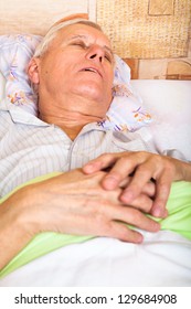 Close Up Of Senior Man Sleeping In Bed.