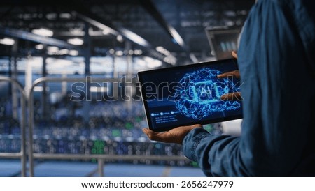 Close up of server farm admin using tablet to do infrastructure AI machine learning automatization. Data center software developer doing maintenance using artificial intelligence,