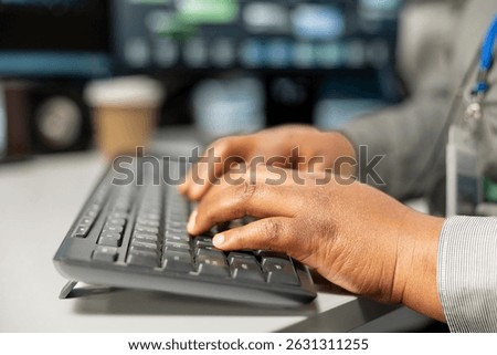 Close up of server room software developer using computer to implement data backup solutions. Data center employee typing on PC keyboard, resolving technical errors, ensuring efficient recovery