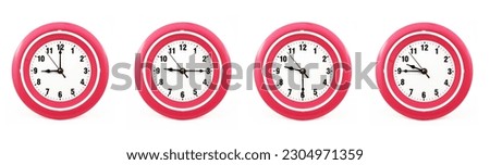 close up of a set of red wall clocks showing the time; 9, 9.15, 9.30 and 9.45 p.m or a.m. Isolated on white background