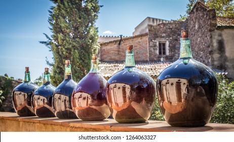 Close Up Of Several Big Old Wine Bottles At A Winery In Spain