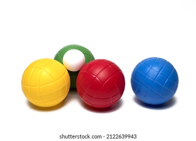Close Up Of Several Different Colored Colorful Plastic Balls With Small Ball For Bocce Game On White Background