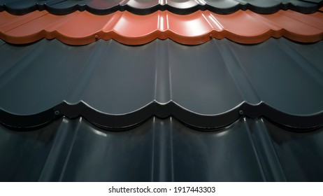 Close Up Of Several Rows Of Plastic Roofing Of Various Colors,black,gray,orange Brown,in Shape Of Tiles Outside On Sunny Day.Outdoor Showcase Of Building Materials Store.Horizontal Banner,copy Space