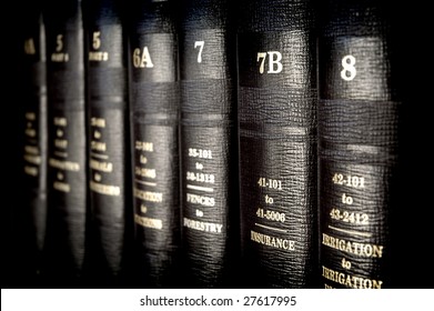 Close Up Of Several Volumes Of Law Books Of Codes And Statutes