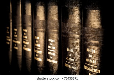 Close up of several volumes of law books of codes and statutes