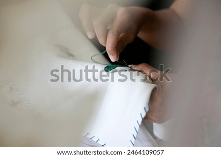 Close up of sewing fabric process
