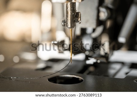 Close Up of Sewing Machine Needle Threading Industrial Details