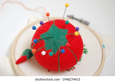 Close Up Of A Sewing Pin Cushion With Pins